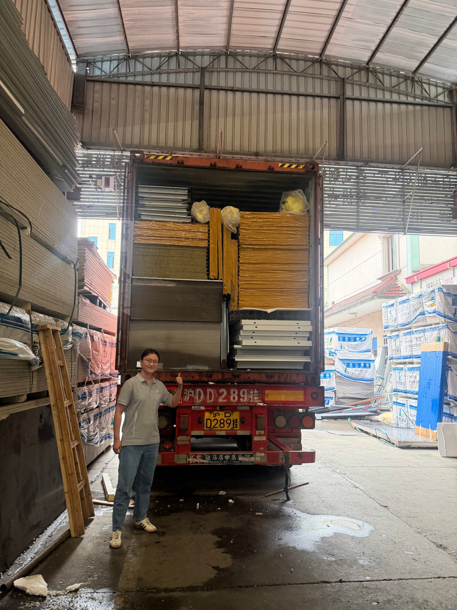 Flat pack container house panels and frame components packed inside a shipping container
