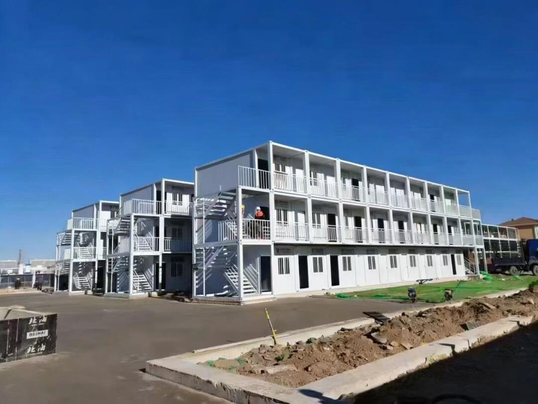 Three-storey modular container building with external stairs and access walkways